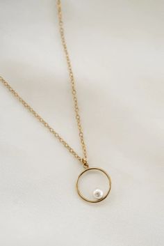 The beautiful Ivy necklace includes a circle pendant which represents notions of totality, wholeness, and timelessness. It also includes an elegant freshwater pearl which, are said to symbolize purity, integrity, and loyalty. Together they are the perfect match. 14k Gold Filled Elegant Jewelry, Elegant 14k Gold Filled Circle Jewelry, Elegant Full Circle Delicate Chain Necklace, Everyday Pearl Drop Round Pendant Jewelry, Delicate Everyday Pearl Necklace, Delicate Round Pearl Necklace For Everyday, Minimalist Pearl Chain With Round Pendant, Minimalist Round Pendant Pearl Chain Jewelry, Minimalist Pearl Chain With Round Pendant Jewelry