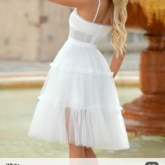 White Beautiful Midi Dress With Tulle. White Knee-length Bridesmaid Dress, Chic Sleeveless Tulle Corset Dress, Chic White Corset Dress With Spaghetti Straps, Chic Dresses With Tulle Skirt And Sweetheart Neckline, Spring Dresses With Spaghetti Straps And Tulle Skirt, Summer Tulle Dresses With Fitted Bodice, Knee-length Tulle Mini Dress For Wedding, Elegant Knee-length Tulle Mini Dress, Summer Tulle Mini Dress With Fitted Bodice