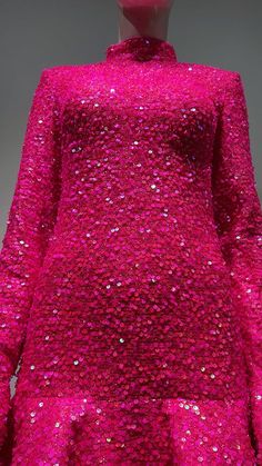 a pink dress with sequins on it