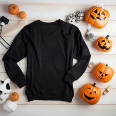 Featuring a flat lay black Gildan 18000 sweatshirt mockup looking all ready for your Halloween store !  This mockup template is perfect for anyone in the Print On Demand industry or looking for a simple and stylish lifestyle mockup. With this digital download, you'll have access to a high-quality image that'll be sure to make your shop stand out and sell those shirts! Don't wait, add this beautiful mockup to your collection today!  Available colors: Black Mockup Details:  Brand:  Gildan 18000 ATTN: Although most colors should match the mockups on Printify and Printful, there may be a few that are slightly off. If you encounter any issues with the color you want to use, please send me a message and I will work with you to find a solution.  This is an instant download with no physical item t Spooky Black Long Sleeve Top, Casual Black Halloween Sweater, Casual Black Sweater For Halloween, Spooky Black T-shirt For Winter, Spooky Long Sleeve Black Sweater, Spooky Black Long Sleeve Sweater, Black Long Sleeve Halloween Sweatshirt, Black Long Sleeve Sweatshirt For Halloween, Halloween Crew Neck Sweater