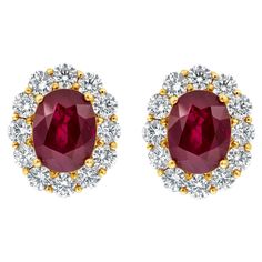 A pleasing pair of gemstone earrings features two color rich GIA Certified oval cut heated rubies weighing 5.69 carats total, surrounded by a single row of brilliant round diamonds in a halo design weighing 2.14 carats total. Made in 18K Yellow Gold. Style available in different price ranges. Prices are based on your selection. Please contact us for more information. Classic Halo Engagement Ring, Contemporary Wedding Rings, Timeless Engagement Ring, Contemporary Engagement Rings, Diamond Earrings Studs Round, Round Diamond Setting, Fancy Yellow Diamond, Engagement Ring Diamond Cut, Halo Earrings