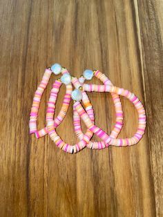 preppy seashell bracelets! amazing for kids/adults. good for birthdays, Christmas, etc Pink Jewelry For Beach Party Season, Pink Jewelry For Beach Party, Pink Bracelets For Beach Season, Pink Beach Bracelets For Beach Season, Pink Beachy Bracelets For Beach Season, Handmade Pink Jewelry For Beach Party, Pink Beachy Jewelry For Beach Season, Pink Strand Beachy Jewelry, Beach Bracelets With Colorful Beads In Coral