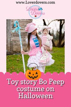 a girl in pink is holding a toy and wearing a costume with a pumpkin on it