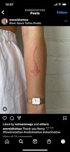 a person with a tattoo on their arm