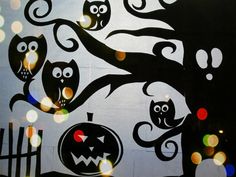 an image of halloween scene with owls and pumpkins