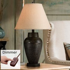 a table lamp sitting on top of a wooden table