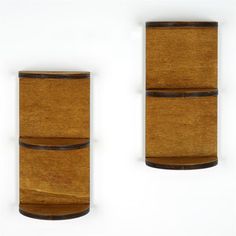 two wooden vases sitting next to each other