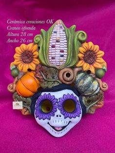 a colorful mask with flowers and corn on the cob in it's center