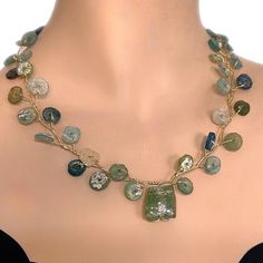 Triumph in elegance is ready: Handmade  Necklace of Victory Werath with Ancient Roman Glass  A captivating Roman glass necklace, a piece of ancient elegance meticulously crafted into a stunning garland in varying shades of blue and green. Immerse yourself in the allure of history with this unique and timeless accessory. This stunning  vine necklace is made of ancient Roman glass round pieces woven with 14K gold filled wire to a beautiful vine with an interesting shred in the center. The necklace Roman Glass Necklace, Vine Necklace, Ancient Roman Glass, Roman Glass, Necklace Craft, Timeless Accessories, Pretty Gift, Handmade Necklace, Glass Necklace