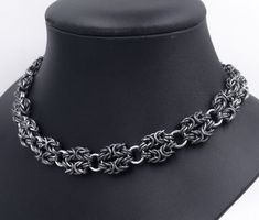 "Handmade heavy sterling silver necklace. Oxidized silver chainmaille links. Polished silver rings inbetween. Traditional byzantine chainmaille with intermittent bigger polished silver rings. Width 15 mm (approx 5/8\"). Also available with all polished silver. Matching bracelet: https://www.etsy.com/listing/1003821246 You order not the exact item on the image, but it's likeness to your specified length. Please contact us for other dimensions than listed. 12 3/8\" (31.5 cm) 13 1/4\" (33.5 cm) 14\ Handmade Silver Gothic Chain Necklace, Gothic Silver Chain Link Jewelry, Medieval Silver Chainmail Jewelry, Byzantine Chainmaille, Norse Necklace, Chain Jewellery, Chunky Chain Necklace, Norse Jewelry, Viking Bracelet