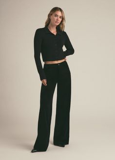 The 90's are back. Only better. There’s a nostalgic fit to the low-rise and wide leg of The Ollie with a baggy, lowrider silhouette. Our favorite detail about these pants, however, is the stretch velvet that elevates the look.92% Polyester, 8% Elastane Machine wash cold Rise / Waist: low rise Hips: loose at hips Leg: baggy leg Average Height: full length (bunches at hem) 11" rise 22.5" knee24" leg opening 32" inseam Megan is 5'10" wearing size 25 Low Rise Black Pants, Average Height, Low Rise Pants, Black Out, Stretch Velvet, Lowrider, Low Rise, Full Length, Wide Leg