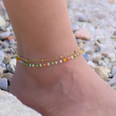 This gold Satellite chain anklet is for women. Its boho style makes it a great piece of summer jewelry. The ankle bracelets have an extension so the size can be adjusted. Adjustable Chain Beaded Bracelets For Beach, Colorful Beads Anklet For Festival, Gold Anklets With Round Beads For Festival, Adjustable Chain Bohemian Beaded Bracelets, Beaded Gold Anklets For Summer, Trendy Gold Anklets For Festivals, Bohemian Beaded Chain Anklets For Festivals, Summer Beaded Gold Anklets, Bohemian Beaded Anklets For Beach