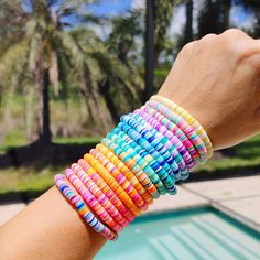 🛒Our preppy, colorful, and bright mixed clay bracelets make the perfect summer (and beyond) accessory! With bright clay heishi beads, you can create unique stacking bracelets to match any outfit. The perfect gift idea for someone special! 📦FREE SHIPPING on orders $35 or more to US shoppers 💎Care = We recommend: -Remove when sleeping -Allow perfumes and lotions to dry before wearing -Roll the bracelet gently on and off your hand instead of overly-stretching the bracelet -Keep away from moisture (although polymer clay itself is water resistant, to extend the life of your jewelry you should avoid wearing in the shower or bath, pool, ocean, or lake, or around water-based chemicals) 🧵Material = 6mm Polymer Clay Heishi Beads, 6mm Gold Metal Bead & Stretch Cord 🎨Color = 17 Mixed Color option Cheap Rainbow Heishi Beaded Bracelets, Clay Beaded Bracelets, Bracelets Preppy, Bracelets Heishi, Colorful Preppy, Make Clay Beads, Clay Bracelets, Clay Bead Necklace, Heishi Bracelet