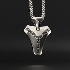 This magnificent pendant is composed of 18k white gold, includes 16 black diamonds and is completely handmade. A talisman stone is for those who want to know what life is all about. It will bring out all of your great qualities. The vertebrae that make up the human spine influenced its design. On a psychological level, this diamond represents what gives man the fortitude, bravery, drive, and unwavering belief to achieve his goals.Many people like white gold because of its silvery white hue, which gives it a refined appearance while also making it considerably more expensive than silver.White gold is impervious to rust, tarnish, and corrosion. White gold is more durable than yellow gold because it is alloyed with a combination of harder metals. Made entirely by hand with all the love and ar Sterling Silver Black Diamond Pendant Necklace, Sterling Silver Pendant Necklace With Black Diamonds, Luxury White Gold Jewelry With Black Spinel, Luxury Black Diamond Pendant Necklace, Modern Sterling Silver Jewelry With Black Diamonds, Luxury Black Spinel Silver Jewelry, Black Diamond Pendant, Human Spine, Hard Metal