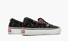 The Supreme x Vans Slip-On Pro “Black Hole Punch Denim” is one of two deconstructed colorways of the casual skate focused silhouette that were released during Supreme’s Spring/Summer 2020 collection.  Supreme and Vans continued their partnership with a “Hole Punch Denim” collaboration that finds Vans’ classic Slip-On Pro and Sk8-Hi Pro in “do-it-yourself” designs.  Here, frayed holes appear on the forefoot, mid-panel, and heel of the black denim upper.  A classic Vans hang tab dots the forefoot. Vans Slip On Pro, Denim Vans, Classic Vans, Vans Slip On, Stadium Goods, Pro Black, Denim Shoes, Sk8 Hi, The Supreme