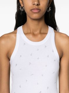 Imagine a tank top that's as comfy as your favorite tee but with a sprinkle of glamour. This top effortlessly combines cool, casual vibes with a touch of sparkle from its rhinestone logo. Perfect for pairing with your go-to jeans or that chic skirt you love. White cotton with ribbed detailing All-over rhinestone logo-lettering Round neck and sleeveless design Straight hem for a clean look Composition: 100% cotton Made in Portugal Season: FW24 Chic Skirts, The Attico, Italian Fashion Designers, Cotton Tank Top, White Crop Top, White Tank Top, Woman Colour, Primavera Estate, Italian Fashion