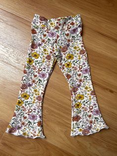 Our gorgeous Retro Flares feature a soft stretchy waistband and beautiful bell bottom pants. Perfect for lazy days around the house, a day out and about, or something a little more special. Wear with a cute t-shirt, crop top or long sleeved top underneath for a bit of extra warmth on those cooler days. We take great privilege in being able to provide you with high-quality handmade clothing designed with your little one's comfort and style in mind, perfect for any occasion. Leave us a review and Spring Non-stretch Flared Hem Pants, Spring Pants With Stretch And Flared Hem, Casual Flare Leggings For Spring, Casual Spring Flare Leggings, Playful Floral Print Bottoms For Spring, Playful Floral Print Spring Bottoms, Playful Wide Leg Bottoms For Spring, Playful Wide Leg Spring Bottoms, Playful Wide-leg Bottoms For Spring