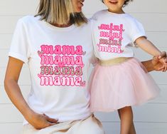 Mama Mini Matching Shirt, Mothe's Day Gift, Mama Tshirt, Mom and Baby Shirt, Mommy And Me Shirt, Family Matching Shirt, New Mom,Mom Daughter ❀DETAIL❀ For printing, we use Bella Canvas and Gildan SoftStyle brand shirts, which are the best in the industry. *Bella Canvas -unisex size -4.2 oz. -Solid colors are 100% Combed Cotton and Ring-Spun Cotton. -Athletic Heather 90% Combed and Ring-Spun Cotton, 10% Polyester -All Heather CVC Colors 52% Combed and Ring-Spun, 48% Polyester *Gildan SoftStyle -un Fun Pink Tops For Family Occasions, Playful Pink Tops For Mother's Day, Fun Short Sleeve Shirt For Mother's Day, White T-shirt With Funny Text For Parenting, White Top With Custom Parenting Print, Pink Matching Tops For Mother's Day, White Top With Custom Print For Parenting, White T-shirt With Funny Parenting Text, White Tops With Custom Parenting Print