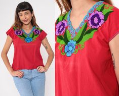 Vintage 90s Mexican blouse in red with floral embroidery, a v neck and short sleeves. Please see measurements and condition below. Every garment we sell is authentic vintage! You will receive the exact item photographed. Condition: Very good vintage. Has some fading on the chest. Best fits women's: Small to medium  Material:  Feels like Cotton MEASUREMENTS Taken from seam to seam while the garment is lying flat. Double the armpit, waist, and hips For reference, model is 5'9" and measures 35-27.5 Red V-neck Blouse With Floral Embroidery, Red Embroidered V-neck Blouse, Vintage Red Tops With Floral Embroidery, Red Vintage Tops With Floral Embroidery, Red Floral Embroidered Short Sleeve Blouse, Vintage Embroidered V-neck Top, Red Bohemian Short Sleeve Blouse, Folk Style V-neck Festival Tops, Vintage V-neck Top With Floral Embroidery