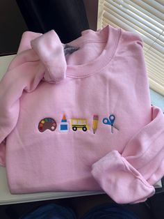 The cutest teacher embroidered sweatshirt! Pink Embroidered College Sweatshirt, Long Sleeve Cotton Sweater For School, Cute Long Sleeve Sweatshirt For School, Preppy Long Sleeve Cotton Sweatshirt, Cute Cotton Crew Sweatshirt, Cute Cotton Crew Neck Sweatshirt, Cute Crew Neck Sweatshirt For Everyday, Cute Long Sleeve Sweatshirt For Everyday, Cute Cotton Sweatshirt With Custom Embroidery