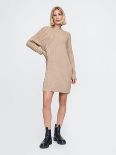 Supersoft cotton-blend cable-knit sweater dress.  Crewneck.  Long sleeves with drop shoulders.  Ribbed hem.  Fit: Over Fall Cable Knit Sweater Dress, Fall Cable Knit Knee-length Sweater Dress, Fall Cable Knit Crew Neck Sweater Dress, Knee-length Cable Knit Sweater, Beige Cable Knit Sweater Dress, Oversized Cable Knit Sweater Dress For Fall, Cozy Cable Knit Sweater Dress For Spring, Casual Cable Knit Winter Dress, Casual Cable Knit Sweater Dress For Winter