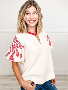 Elevate your style with our Solid V-Neck Bubble Sleeve Top! The unique leaf embroidery adds a touch of elegance, while the bubble sleeves add a playful flair. Perfect for any occasion, this top is both versatile and fashionable. Turn heads and make a statement with this must-have addition to your wardrobe. Fabric- 80% Polyester, 20% Cotton, Contrast: 50% Polyester, 50% Rayon Casual V-neck Top With Embroidered Sleeves, Puff Sleeve Tops With Floral Embroidery For Fall, Floral Embroidery Puff Sleeve Tops For Fall, Floral Embroidered Puff Sleeve Tops For Fall, Fall Floral Embroidery Puff Sleeve Tops, White Puff Sleeve Tops With Embroidered Sleeves, Embroidered Puff Sleeve Tops For Fall, White Tops With Floral Embroidery And Bishop Sleeves, White Bishop Sleeve Tops With Floral Embroidery