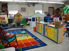 a classroom filled with lots of toys and desks