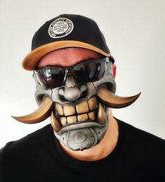 a man wearing a skull mask and sunglasses