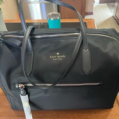 Kate Spade Black New With Tags Overnight Bag Black Travel Bag With Detachable Handle For On-the-go, Elegant Top Handle Travel Bag For Shopping, Elegant Travel Bag With Top Handle For Shopping, Elegant Travel Bag With Removable Pouch For Shopping, Elegant Travel Bag With Double Handle And Dust Bag, Black Top Handle Travel Bag With Detachable Handle, Elegant Black Travel Bag With Top Carry Handle, Black Luxury Travel Bag With Detachable Handle, Elegant Travel Bag For On-the-go With Dust Bag