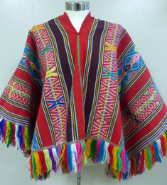 "From the Andean Mountains of Peru Colorful Shama's poncho Brought from the village of Ocongate in the mountains near Cusco Peru. This type of Poncho is used by the Andean Shamans from villages in the mountains of Ocongate - Cusco. It is handmade with the Awayu method. The designs are Incan geometrical designs. Awayu.- Aguayo or \"Awayu\" is part of Andean cosmology. The aguayo is a hand-woven fabric with alpaca, llama, or sheep wool, it is dyed with natural vibrant color. Colors: Red, blue, whi Cusco Peru, In The Mountains, Sheep Wool, The Village, Llama, Alpaca, Peru, Hand Woven, Woven Fabric