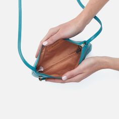 This mini crossbody is perfect in its simplicity, with a zip pocket and room for your keys, wallet and phone. Cara Crossbody In Polished Leather  Biscayne Blue SLG CROSSBODY Bag in Blue | Hobo® Blue Versatile Phone Bag For Everyday Use, Versatile Blue Phone Bag For Everyday Use, Versatile Everyday Blue Phone Bag, Everyday Blue Phone Bag With Adjustable Strap, Blue Crossbody Phone Bag For Everyday, Blue Phone Bag With Zipper Closure, Everyday Blue Phone Bag With Zipper Closure, Blue Phone Bag With Zipper, Everyday Blue Phone Bag