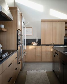 the kitchen is clean and ready for us to use it's counters, ovens, cabinets, and counter tops