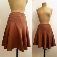 "ET VOUS PARIS 1920s style bias cut, low waist skirt. Short and flippy, fitted through waist & high hips and then opening to circle skirt type fullness at hem. Asymmetrical, front is longer than back. Matte side satin waistband & engineered front and back inserts, shiny side satin for skirt. Center back invisible zipper, fully lined. Fits XS, S / O, 2 (36EU) 28\" Low Waisted 100% Viscose, Made in EU Excellent Condition MEASURMENTS * Waist: 28\" / 71cm * Hips: 37\" / 94cm * Sweep from sid 1920s Skirt, Paris 1920s, Low Waist Skirt, Skirt Satin, 1920s Style, Bias Cut Skirt, Skirt Short, High Hips, Cocoa Brown