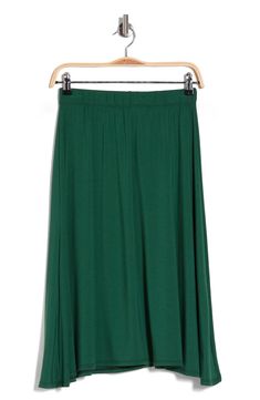 A flared silhouette sways with every step you take in this lightweight knit midi skirt topped with an elastic waist. Elastic waist 47% rayon, 47% polyester, 6% spandex Machine wash, dry flat Made in the USA Stretch Midi Skirt In Solid Color, Stretch Solid Color Midi Skirt, Midi-length Bottoms With Elastic Waistband And Stretch, Stretch Midi Bottoms With Elastic Waistband, Stretch Bottoms With Elastic Waistband And Midi Length, Stretch Flared Maxi Skirt In Solid Color, Casual Flowy Viscose Maxi Skirt, Casual Viscose Maxi Skirt With Relaxed Fit, Casual Relaxed Viscose Maxi Skirt