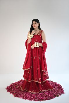 Designed on a beautiful tone of maroon in handloom cotton net, this panelled kalidaar features gold ada work of dabka naqshi, sequins and nug. An alluring three piece is paired with a heavily embellished dupatta and flappers. The length of the kalidaar is 46 inches. Order Duration: 4 to 6 weeks Raw Silk Unstitched Suit With Dabka For Reception, Raw Silk Dupatta With Dabka For Reception, Chinon Sharara With Dabka For Reception, Unstitched Chinon Anarkali Set For Designer Wear, Designer Nida Lehenga With Mirror Work, Designer Lehenga With Mirror Work, Unstitched Shantoon Lehenga With Dabka Work, Nida Sharara With Mirror Work For Wedding, Nida Fabric Wedding Sets With Mirror Work