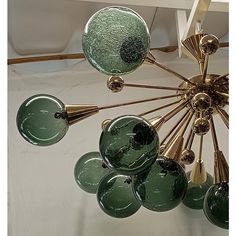 a green chandelier hanging from the ceiling