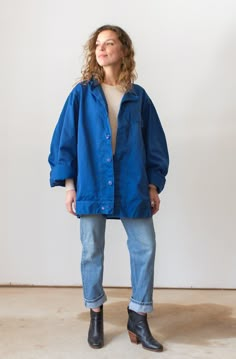 "Vintage Blue Coat with one front flap pocket, Snap at waist panel, covered placket. Blue button Front. Underarm and side seam are lined in snaps. Sleeve has a rounded shape. Love the \"Matisse\" Blue color. Good for transitional weather. Maker: Military | Made in USA | Material: 100% Cotton Condition: Good. Washed Deadstock. LARGE: Shoulders: 19\" | Chest: 24\" | Length: 29\" | Sleeve: 25\" Ellie is 5'3\" and wears Small in tops. This could fit a larger frame. SHOP http://www.rawsonstudio.etsy. Matisse Blue, Side Snap, Blue Coat, Work Jacket, Chore Jacket, Blue Coats, Work Jackets, Mode Inspo, 가을 패션