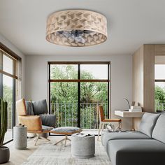 a living room filled with furniture next to windows and a cactus in the middle of the room