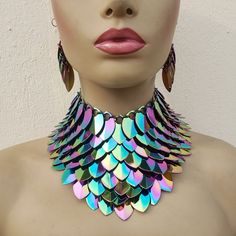 please view https://www.etsy.com/shop/Clearmilkdesign  so that you can find more Unique personalized design and follow my shop,you will see my new arrival design The closure is Lobster claw Adjustable Chain Transform your look with our Iridescent Rainbow Alloy Scalemail Choker Collar - a mesmerizing and enchanting piece that captures the whimsical allure of dragon scales. This unique choker, crafted with iridescent rainbow alloy scales, adds a touch of fantasy and magic to your ensemble. Perfect Silver Rave Jewelry For Party, Handmade Iridescent Metal Jewelry, Handmade Fantasy Jewelry For Party, Handmade Fantasy Style Jewelry For Parties, Unique Iridescent Jewelry For Festivals, Handmade Rave Jewelry For Party, Handmade Multicolor Fantasy Jewelry, Iridescent Unique Metal Jewelry, Silver Rave Jewelry For Gift