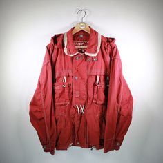 Beautiful blouson in size L from Oil Company. Really nice piece! Basic color red. Has 2 practical side pockets & zipper. Additionally cool chest pockets. Without hood. Without shoulder pads. 100% cotton. You can find more blousons, bomber jackets and other vintage clothes in our Etsy shop. If you have any questions, just write to us! Your soul & style from Berlin P.S.: Our clothes are vintage, so not new. We list defects that go beyond expected signs of wear (e.g. stains, missing buttons, holes, Red Hooded Jacket With Pockets For Outdoor Activities, Cotton Utility Jacket With Pockets For Outdoor Activities, Winter Cotton Hooded Jacket With Multiple Pockets, Cotton Utility Hooded Jacket With Pockets, Hooded Cotton Utility Jacket For Outdoor Activities, Cotton Hooded Utility Jacket For Outdoor Activities, Red Parka With Pockets For Outdoor, Casual Cotton Utility Jacket For Streetwear, Red Parka With Pockets For Fall