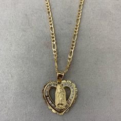 Brand New Virgin Mary Heart Pendant Solid 14 Kt Gold, Lady Guadalupe Charm With 18 In 14 Kt Chain High Quality Jewelry Store Pick Up At Store In Downtown La Available 762 S Broadway, Los Angeles, Ca 90014 Message Us Any Questions You Have. We Ship World Wide Gold Double Heart 14k Stamped Jewelry, Elegant Heart Shaped Figaro Chain Necklace, Elegant Heart-shaped Figaro Chain Necklace, Figaro Chain Jewelry With Heart Pendant, Elegant Jewelry With Figaro Chain And Heart Pendant, Yellow Gold Necklace With Figaro Chain And Heart Pendant, Elegant Figaro Chain Jewelry For Valentine's Day, Gold Heart Pendant Necklace With Diamond Cut, Gold Necklace With Diamond Heart Cut