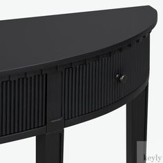 an oval shaped black console table with two drawers on one side and three doors on the other