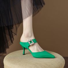 Elegant and stylish mules that offer you an effortless chic look. Upper: Genuine Leather Lining: Genuine Leather Outsole: Rubber Toe Shape: Pointy Toe Heel: 6.5cm/2.5'' Closure: Slip on Fashion Element: Square Rhinestone Decoration is_handmade: Yes Elegant Green Slip-on Mules, Green Flat Heel Sandals For Evening, Green Flat Heel Evening Sandals, Evening Green Flat Heel Sandals, Slip-on Evening Heels For Spring, Party Mules With Buckle Closure And Round Toe, Green Pointed Toe Mules For Party, Slip-on Heels With Buckle Closure For Party, Party Heels With Buckle Closure Slip-on