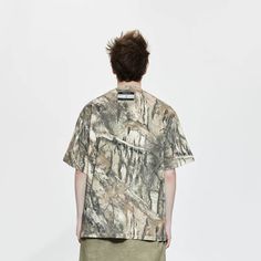 The Forest Camo Pocket T-Shirt seamlessly blends military style with casual comfort. This tee features an all-over woodland camo print, providing a rugged and trendy look. The left chest pocket adds a functional and stylish element, while the drop shoulder design enhances the relaxed fit. A brand logo is sewn just below the back neckline, adding a touch of authenticity. Crafted from premium 100% cotton fabric, this slightly oversized t-shirt ensures both durability and comfort, making it a perfect addition to any casual wardrobe. All-over woodland camo print Left chest pocket Drop shoulder design Brand logo sewn below back neckline Premium 100% cotton fabric Slightly oversized fit Composition: 100% Cotton Brand： LIFEGOESON Wearing: Male model is 185 cm / 6’ 1’’ | 65 kg / 143 lbs wearing si Relaxed Fit Camouflage T-shirt With Graphic Print, Casual Camouflage T-shirt Relaxed Fit, Camouflage Cotton Top With Pockets, Camouflage Cotton Tops With Pockets, Cotton Camouflage Tops With Pockets, Camouflage Military Tops With Pockets, Camouflage Graphic Print Relaxed Fit T-shirt, Military Camouflage Tops With Pockets, Military Style Camouflage Tops With Pockets