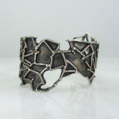 "This INCREDIBLE cuff was made in sterling silver circa 1970's in the Brutalist style and man does it look amazing on!  Gorgeous.  Fits a small to medium wrist. Not stamped or signed but tested for sterling silver. Measures 1 5/8\" at the widest.  Interior measures 2.5 x 2\".  Opening is currently 1\" but can be adjusted by a jeweler. Weighs 66 grams. In great vintage condition with excellent patina. All purchases from Bavier Brook arrive in an elegant box, fully wrapped in fine paper. Please inquire for international shipping. Don't hesitate to ask if you have any questions, we are happy to answer them!" Modern Bracelet, Hudson Ny, Modern Bracelets, Modernist Jewelry, Vintage Bracelet, Post Modern, Jewelry Inspo, Vintage Bracelets, Postmodernism