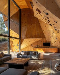 a living room filled with furniture and wooden walls