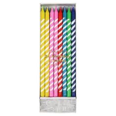 six brightly colored birthday candles in a package