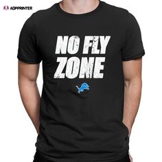 Detroit Lions No Fly Zone T-shirt Graphic Tee For Fan Events With Letter Print, Graphic Tee With Letter Print For Fan Events, Funny Letter Print Tops For Fans, Letter Print T-shirt For Fan Events, Black T-shirt With Letter Print For Fan Events, Black Letter Print T-shirt For Fan Events, Fan Apparel Tops With Slogan, Slogan Tops For Fans, Band Merch T-shirt With Team Name And Crew Neck