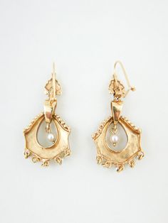 Delicate pearl & gold dangling mini chandelier earrings from around 1920/30’s. 1.5”(h) x 0.75”(w)Marks: 14K Condition: Excellent Victorian Style Drop Pearl Earrings, Victorian Pearl Earrings For Anniversary, Antique Pearl Drop Earrings For Formal Occasions, Antique Chandelier Earrings For Formal Occasions, Antique Drop Pearl Earrings For Formal Occasions, Antique Formal Dangle Chandelier Earrings, Antique Dangle Chandelier Earrings For Formal Occasions, Victorian Pearl Earrings For Wedding, Vintage Yellow Gold Drop Pearl Earrings