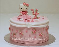 a hello kitty cake with pink and white frosting